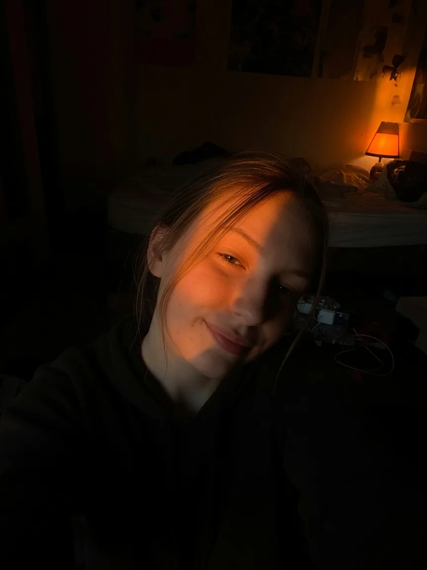 Underexposed orange light selfie that confuses age cues